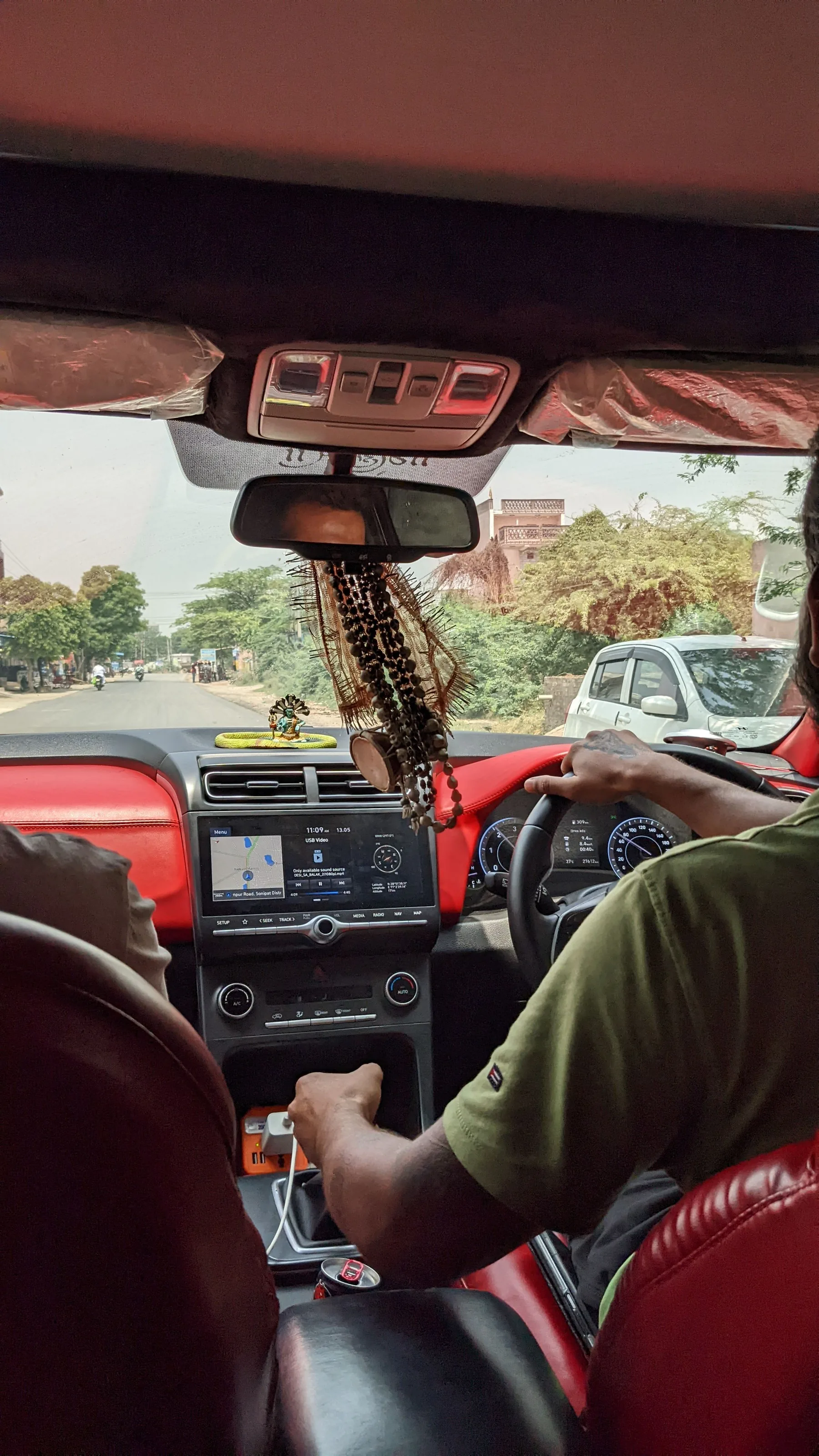 Driver and passenger inside a car in India